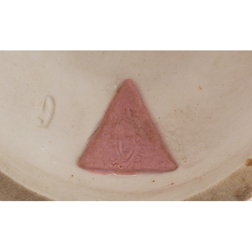 487 - A Royal Dux Czechoslovakian porcelain figure of a snake charmer, 24cm high.