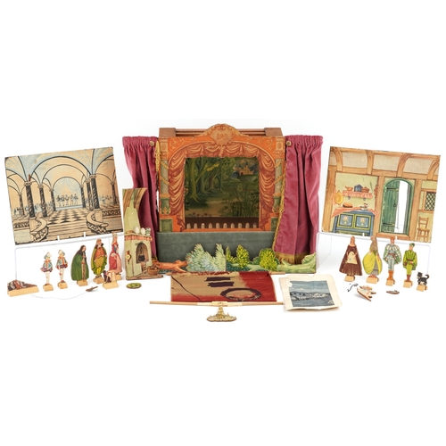782 - A Benjamin Pollock's Toy Theatre and puppets, with figures and props fitted with velour curtains, 40... 