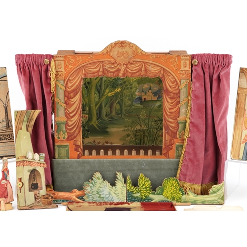782 - A Benjamin Pollock's Toy Theatre and puppets, with figures and props fitted with velour curtains, 40... 