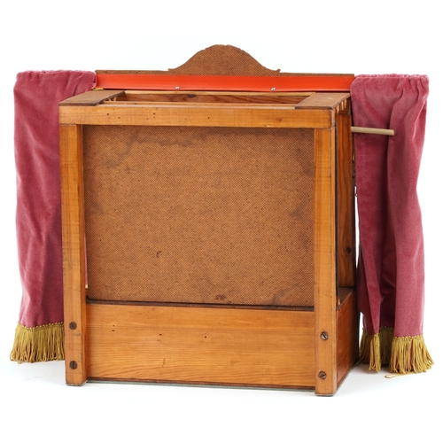 782 - A Benjamin Pollock's Toy Theatre and puppets, with figures and props fitted with velour curtains, 40... 