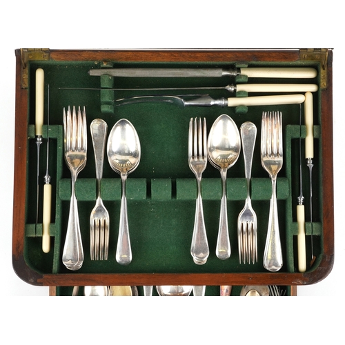 3749 - An Art Deco walnut cased canteen of stainless steel cutlery, 36cm wide.