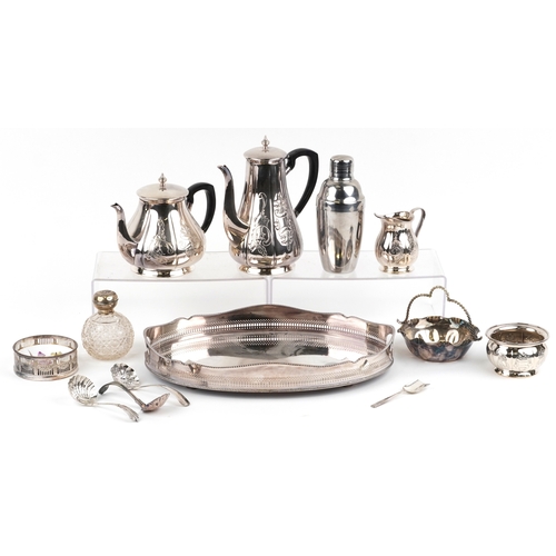 1616 - A small collection of silver plated items including an oval tray, teapot, cocktail shaker, wine coas... 
