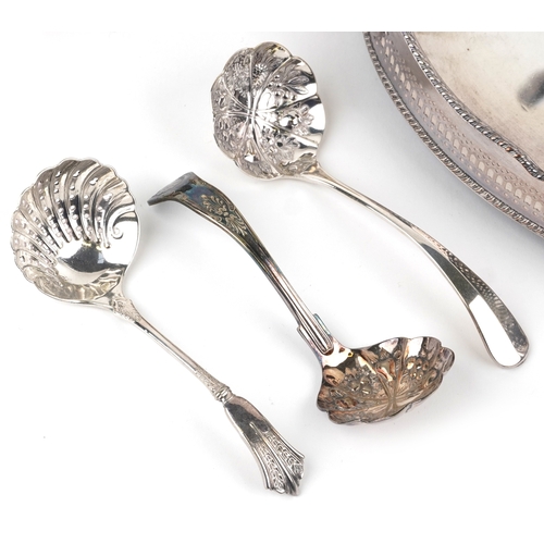1616 - A small collection of silver plated items including an oval tray, teapot, cocktail shaker, wine coas... 