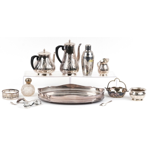 1616 - A small collection of silver plated items including an oval tray, teapot, cocktail shaker, wine coas... 