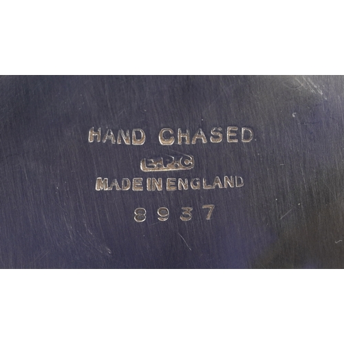 1616 - A small collection of silver plated items including an oval tray, teapot, cocktail shaker, wine coas... 