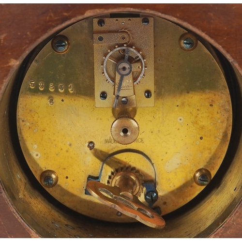 128 - An Edwardian mahogany cased mantle clock with chequer stringing, the white enamelled dial inscribed ... 