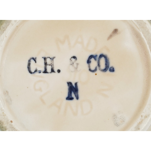 648 - 20th century pottery including a Royal Copenhagen bear cub, a Majolica picture and a Shorter & Sons ... 