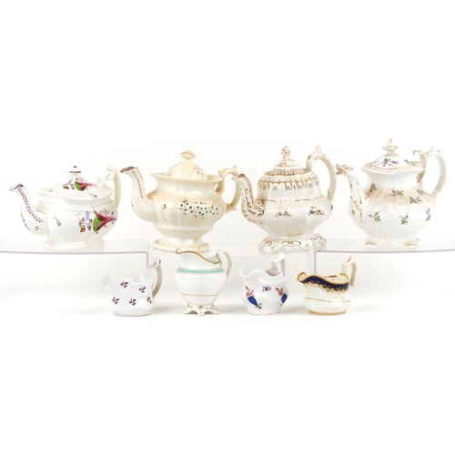 430 - 19th century English porcelain teapots and milk jugs, each with hand painted decoration, the largest... 