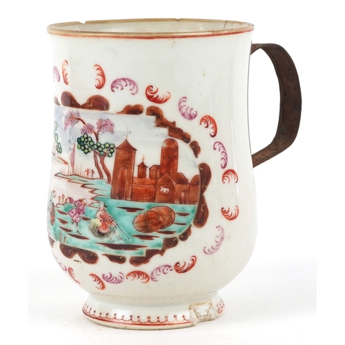 353 - A Chinese export porcelain tankard with metal handle hand painted with a European scene, 16cm high.