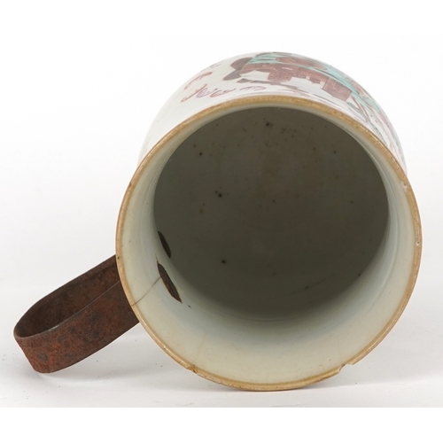 353 - A Chinese export porcelain tankard with metal handle hand painted with a European scene, 16cm high.