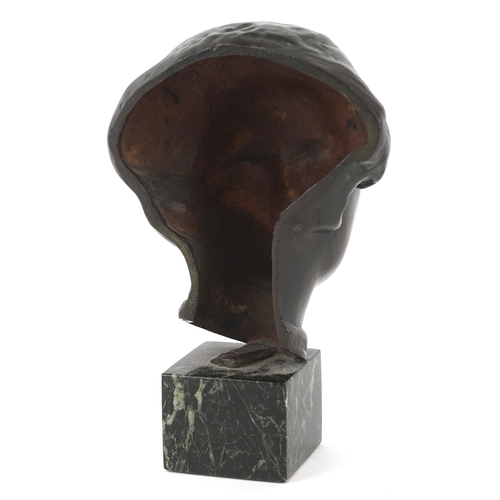 227 - A patinated bronze portrait of an Asian female raised on a marble base, 17cm high.