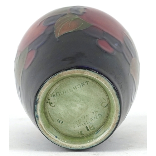 181 - A William Moorcroft Pomegranate pattern pottery vase, 9cm high.