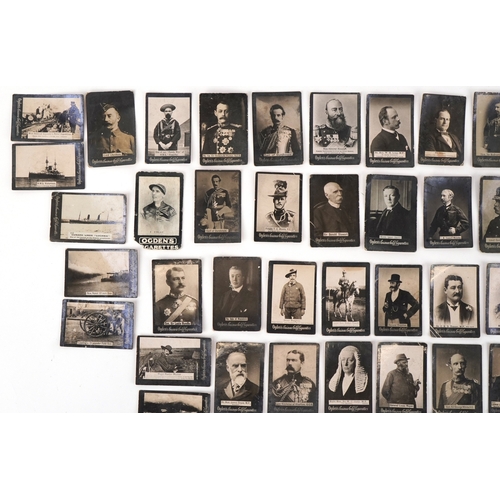 1300 - A collection of Ogden's Guinea Gold cigarette cards including a young Winston Churchill, Queen Victo... 