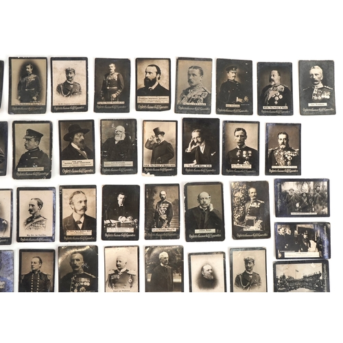 1300 - A collection of Ogden's Guinea Gold cigarette cards including a young Winston Churchill, Queen Victo... 