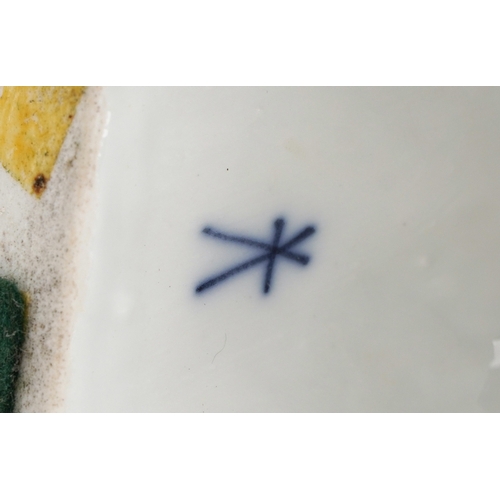 37 - An early 20th century Sampson porcelain parrot perched on a tree stump, 40cm high.