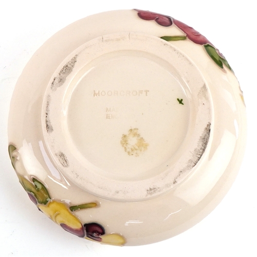 187 - A white Moorcroft pottery bowl hand painted in the Hibiscus pattern, 12cm in diameter.