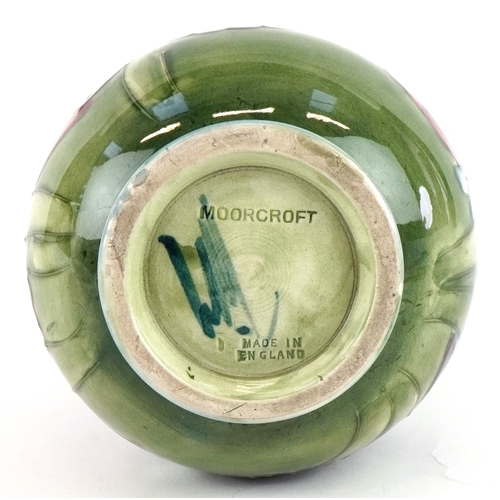 183 - A Moorcroft pottery baluster vase hand painted in the Orchid pattern 13cm high.