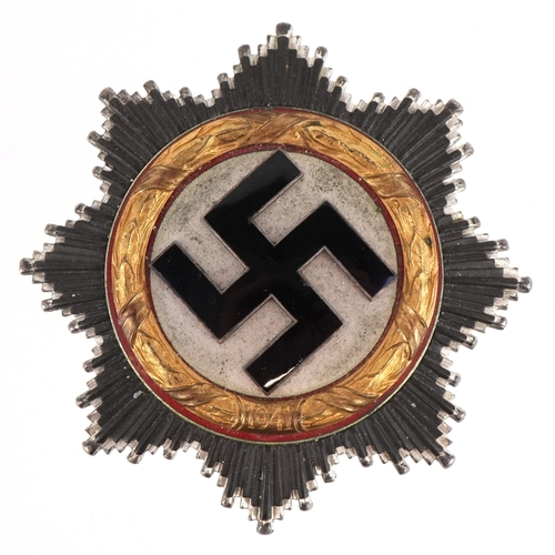 A German military interest World War II German cross in gold award, 6cm in diameter.