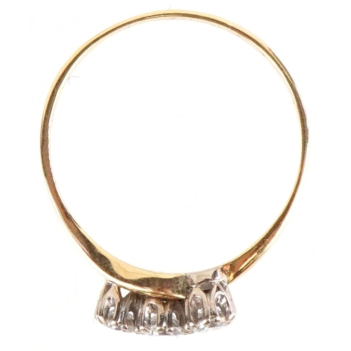 3014 - An 18ct gold diamond three stone crossover ring, total diamond weight approximately 0.40 carat, size... 