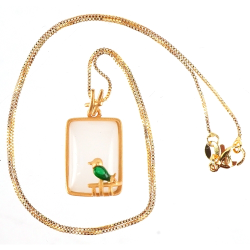 3343 - A yellow metal opalescent pendant mounted with a bird, on a silver gilt necklace, 2.7cm high and 44c... 