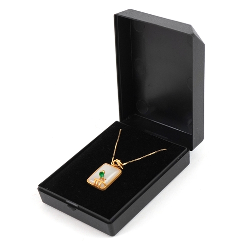 3343 - A yellow metal opalescent pendant mounted with a bird, on a silver gilt necklace, 2.7cm high and 44c... 