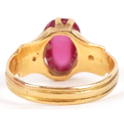 3018 - An unmarked high carat gold cabochon ruby ring, the ruby approximately 9.40mm x 6.0mm x 3.60mm deep,... 