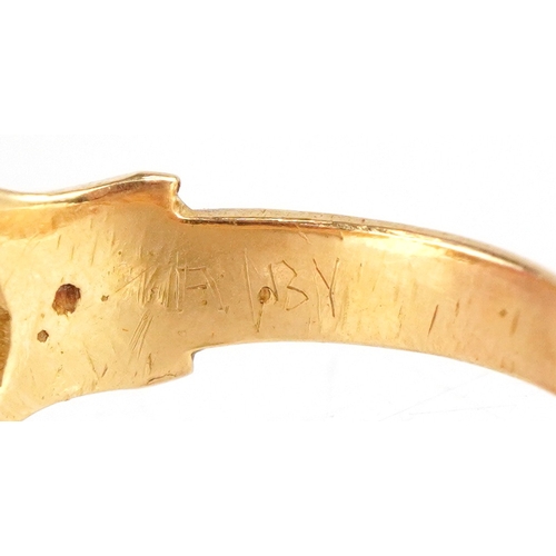 3018 - An unmarked high carat gold cabochon ruby ring, the ruby approximately 9.40mm x 6.0mm x 3.60mm deep,... 