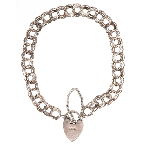 3257 - A silver multi link charm bracelet with love heart shaped padlock clasp, 18cm in length, 11.0g.