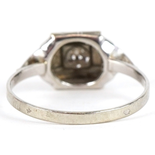 3360 - A French Art Deco white metal diamond solitaire ring, impressed eagle head mark, size M, 1.2g.
