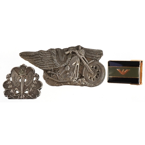 1843 - Three vintage belt buckles including 1986 motorcycle buckle and a white metal wings and torch flame ... 