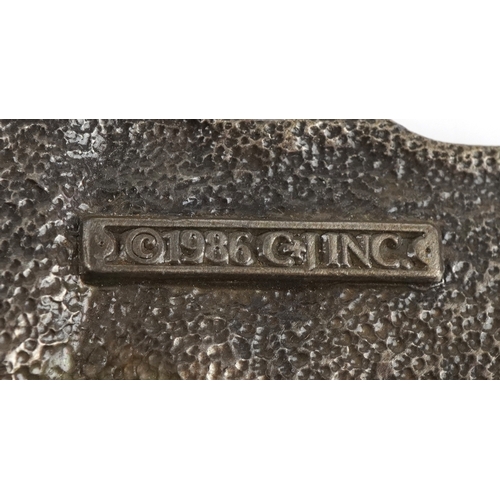 1843 - Three vintage belt buckles including 1986 motorcycle buckle and a white metal wings and torch flame ... 