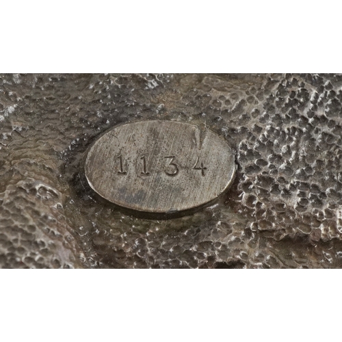 1843 - Three vintage belt buckles including 1986 motorcycle buckle and a white metal wings and torch flame ... 