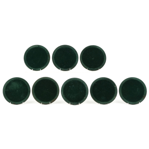 1639 - A set of eight Walt Disney Productions silver plated coasters engraved with Disney figures, 19cm in ... 