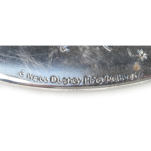 1639 - A set of eight Walt Disney Productions silver plated coasters engraved with Disney figures, 19cm in ... 