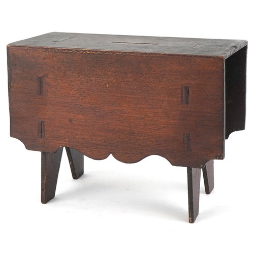 1535 - A Victorian carved wood money box in the form of a drop leaf table, inscribed Hazel, 13.5cm high x 1... 