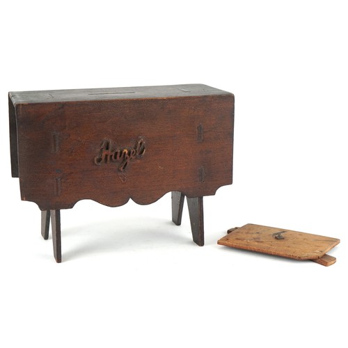 1535 - A Victorian carved wood money box in the form of a drop leaf table, inscribed Hazel, 13.5cm high x 1... 