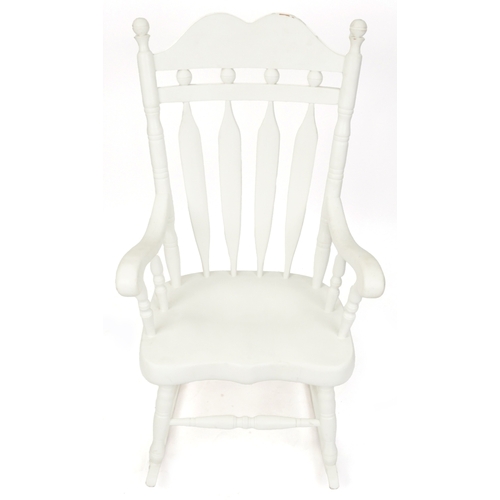 2085 - A 20th century white painted rocking chair on turned supports, 116cm H x 65cm W x 77cm D.