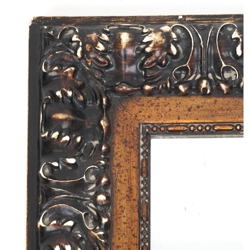 2162 - A late 20th century rectangular mirror with scrolling moulded frame, 110cm x 80cm.