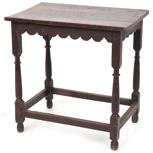 2108 - A Victorian oak rectangular side table raised on turned and block legs united by stretchers, 62cm H ... 