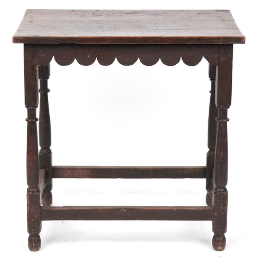 2108 - A Victorian oak rectangular side table raised on turned and block legs united by stretchers, 62cm H ... 