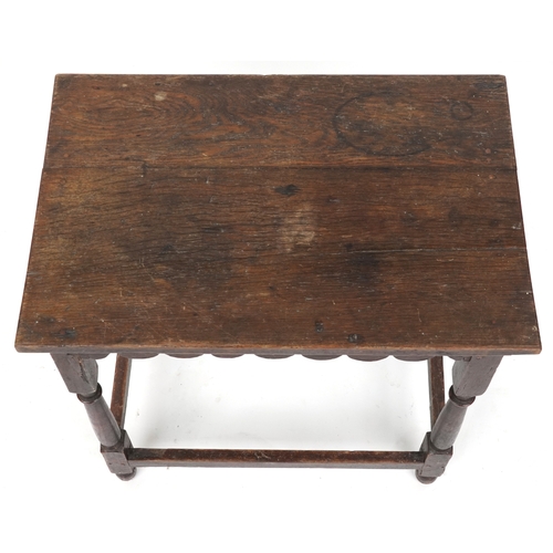 2108 - A Victorian oak rectangular side table raised on turned and block legs united by stretchers, 62cm H ... 