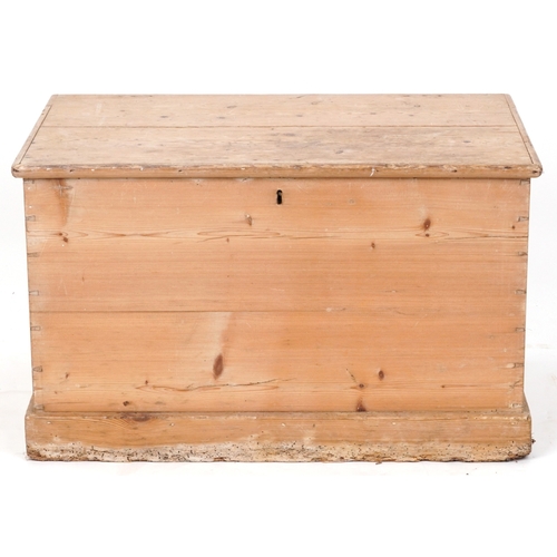 2013 - An early 20th century stripped blanket box, the hinged lid revealing a candle box, fitted with drop ... 