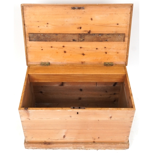 2013 - An early 20th century stripped blanket box, the hinged lid revealing a candle box, fitted with drop ... 