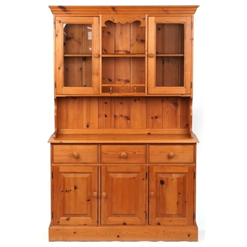 2133 - A late 20th century pine dresser, the shelf back fitted with a pair of glazed doors above three shor... 