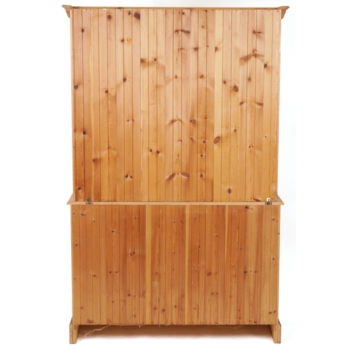 2133 - A late 20th century pine dresser, the shelf back fitted with a pair of glazed doors above three shor... 