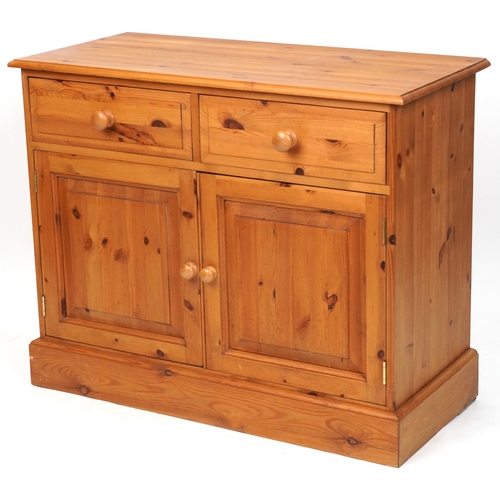 2140 - A late 20th century pine side cabinet fitted with two drawers and cupboards, on a plinth base, 81cm ... 