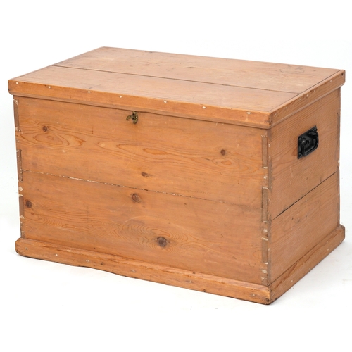 2183A - An early 20th century pine blanket box fitted with applied metal handles, 47cm H x 73cm W x 46cm D.