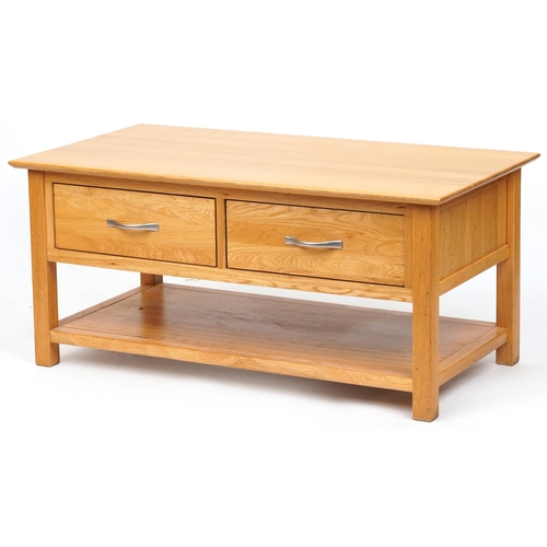 2036 - A modern oak coffee table fitted with two drawers above and under tier, 50cm H x 109cm W x 58cm D.