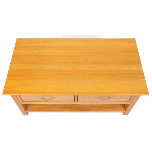 2036 - A modern oak coffee table fitted with two drawers above and under tier, 50cm H x 109cm W x 58cm D.