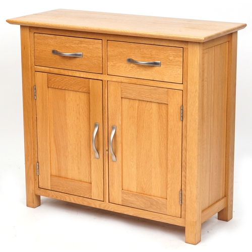 2070 - A modern oak side cabinet fitted with two drawers above cupboards on stile supports, 77cm H x 85cm W... 